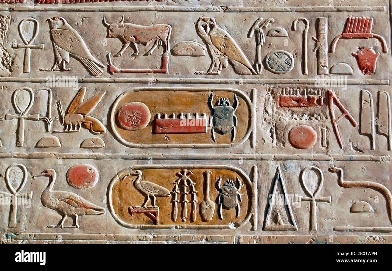 Egypt: Hieroglyphic inscription from the Mortuary Temple of Queen Hatshepsut. Deir el-Bahari, Luxor, c. 1458 BCE.  Deir el-Bahari or Deir el-Bahri ( 'The Northern Monastery') is a complex of mortuary temples and tombs located on the west bank of the Nile, opposite the city of Luxor, Egypt.  The focal point of the Deir el-Bahari complex is the Djeser-Djeseru meaning 'the Holy of Holies', the Mortuary Temple of Hatshepsut. It is a colonnaded structure, which was designed and implemented by Senemut, royal steward and architect of Hatshepsut (and believed by some to be her lover). Stock Photo