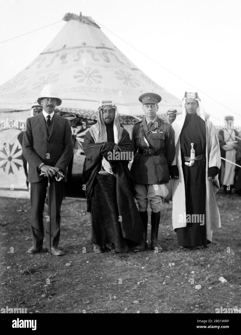 Jordan: The Emir Abdullah I with Sir Herbert Samuel and Sir Wyndham Deedes, 18 April 1921  Abdullah I bin al-Hussein (February 1882 - 20 July 1951), King of Jordan, was the second of three sons of Sherif Hussein bin Ali, Sharif and Emir of Mecca.  He was educated in Istanbul, Turkey and Hijaz. From 1909 to 1914, Abdullah sat in the Ottoman legislature, as deputy for Mecca, but allied with Britain during World War I. Between 1916 to 1918, working with the British guerrilla leader T. E. Lawrence, he played a key role as architect and planner of the Great Arab Revolt against Ottoman rule. Stock Photo