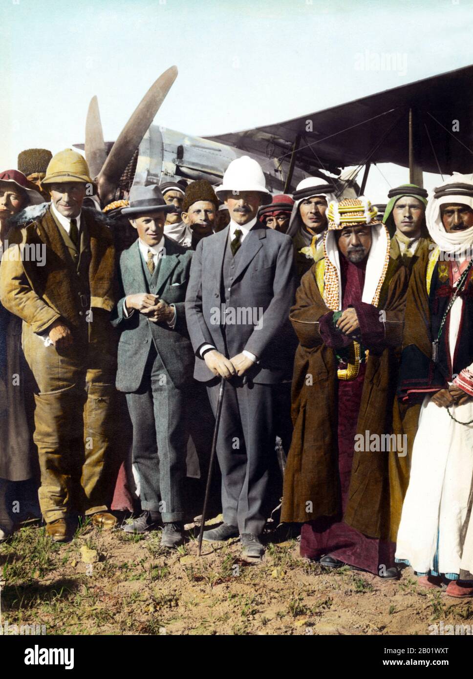 Jordan: King Abdullah I of Jordan with T. E. Lawrence (Lawrence of Arabia), Sir Herbert Samuel, Sheik Majid Pasha el Adwan (far right) and Gertrude Bell (left) at the aerodrome of Amman, April 1921.  Abdullah I bin al-Hussein (February 1882 - 20 July 1951), King of Jordan, was the second of three sons of Sherif Hussein bin Ali, Sharif and Emir of Mecca.  Lieutenant Colonel Thomas Edward Lawrence, CB, DSO (16 August 1888 - 19 May 1935), known professionally as T. E. Lawrence, was a British Army officer renowned especially for his liaison role during the Arab Revolt against Ottoman Turkish rule. Stock Photo