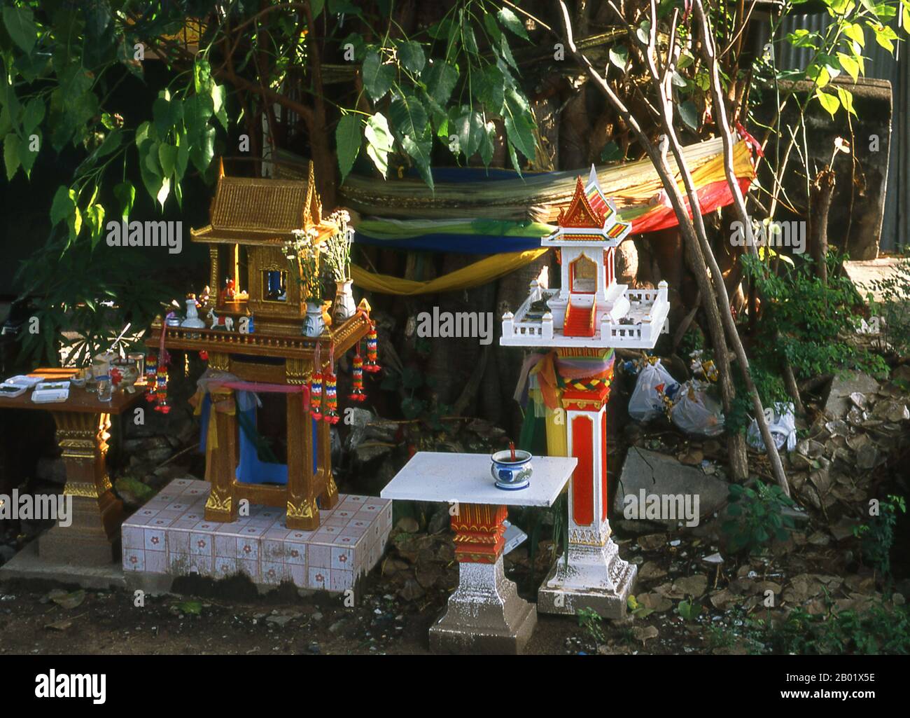 Thailand: Spirit houses at Wat Yang Kuang before renovation, Suriyawong Road, Chiang Mai, northern Thailand.  Chiang Mai is often called Thailand’s ‘Rose of the North’, and is the country’s second city and a popular tourist destination due primarily to its mountainous scenery, colourful ethnic hilltribes and their handicrafts.  Founded in 1296 by King Mengrai as the capital of his Lanna kingdom, Chiang Mai was later overrun by Burmese invaders in 1767. The city was then left abandoned between 1776 and 1791. Chiang Mai formally became part of Siam in 1774 by an agreement. Stock Photo