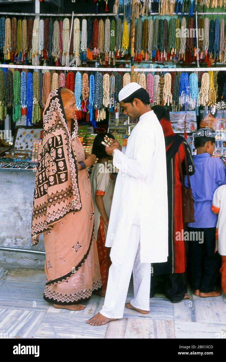 India: A bangle and bead shop next to the Dargah Sharif of Sufi saint Moinuddin Chishti, Ajmer, Rajasthan.  Sultan-ul-Hind, Moinuddin Chishti (1141-1230), also known as Gharīb Nawāz ('Benefactor of the Poor'), was the most famous Sufi saint of the Chishti Order of the Indian Subcontinent. He introduced and established the order in South Asia.  Ajmer (Sanskrit: Ajayameru) was founded in the late 7th century CE by Dushyant Chauhan. The Chauhan dynasty ruled Ajmer in spite of repeated invasions by Turkic marauders from Central Asia across the north of India. Ajmer was conquered in 1193. Stock Photo