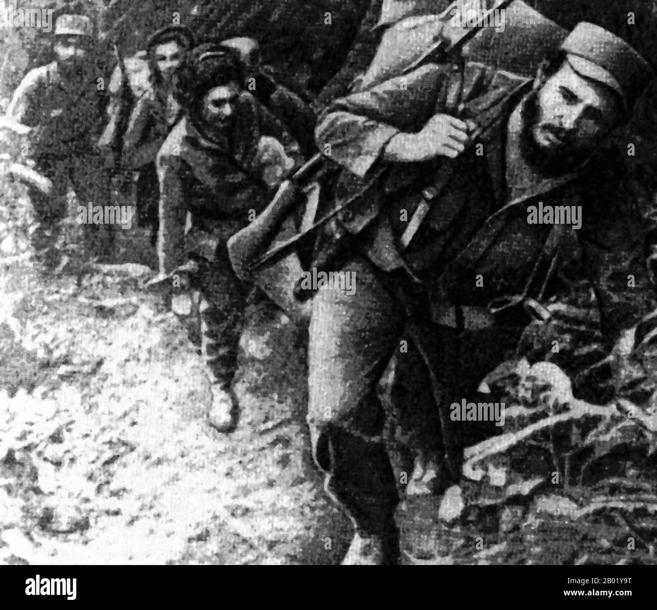 Cuba: Fidel Castro (13 August 1926 - 25 November 2016) with a group of guerrillas in the Sierra Madre, c. 1958.   The female guerrilla following him is probably Celia Sánchez Manduley (9 May 1920 - 11 January 1982), a participant of the Cuban Revolution and a close friend and rumoured lover of Fidel Castro  Fidel Alejandro Castro Ruz was a Cuban political leader and communist revolutionary. As the primary leader of the Cuban Revolution, Castro served as the Prime Minister of Cuba from February 1959 to December 1976, and then as the President of the Council of State of Cuba until 2008. Stock Photo