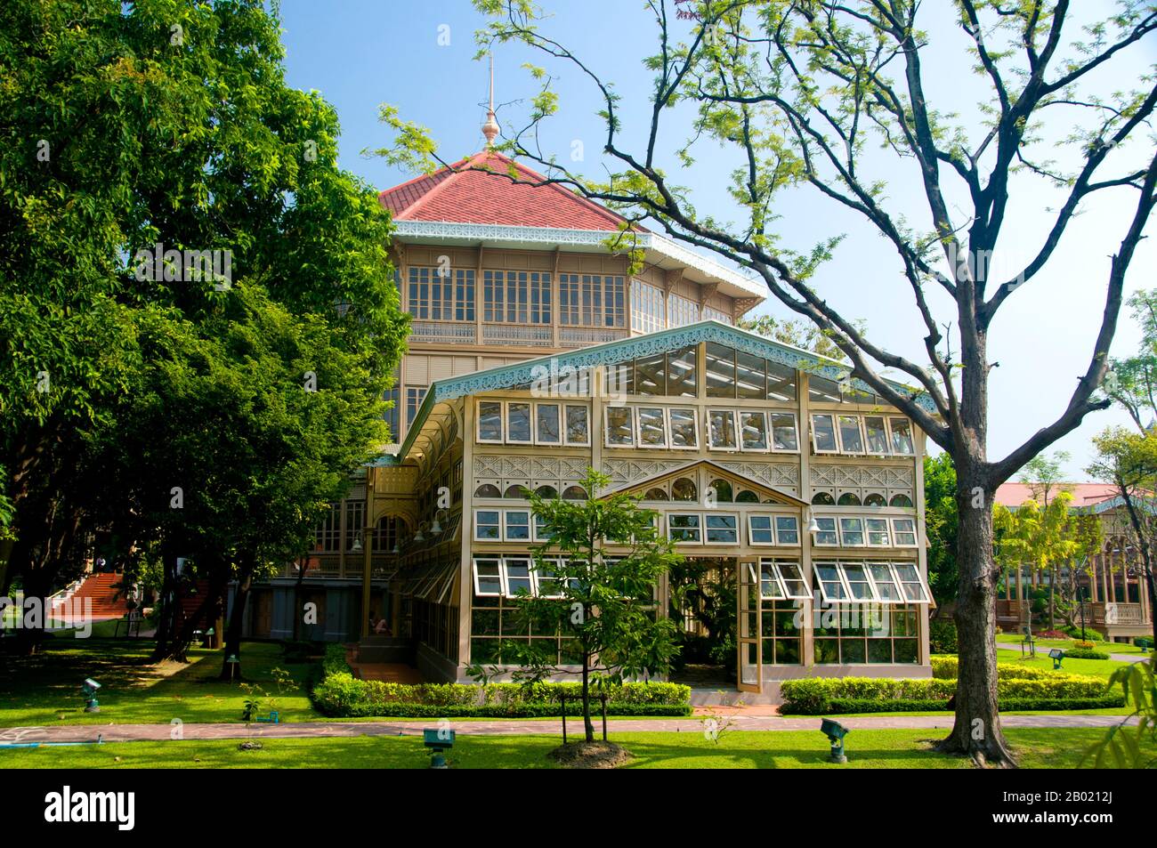 The Vimanmek Mansion is a former royal palace and is also known as the Vimanmek Teak Mansion or Vimanmek Palace.  Vimanmek Mansion was built in 1900 by King Rama V (King Chulalongkorn) by having the Munthatu Rattanaroj Residence in Chuthathuj Rachathan at Ko Sichang, Chonburi, dismantled and reassembled in Dusit Garden. It was completed on March 27, 1901 and used as a royal palace by King Rama V for five years.  In 1982 Queen Sirikit asked permission of King Rama IX (Bhumibol Adulyadej) to renovate Vimanmek Palace for use as a museum to commemorate King Rama V by displaying his photographs, pe Stock Photo