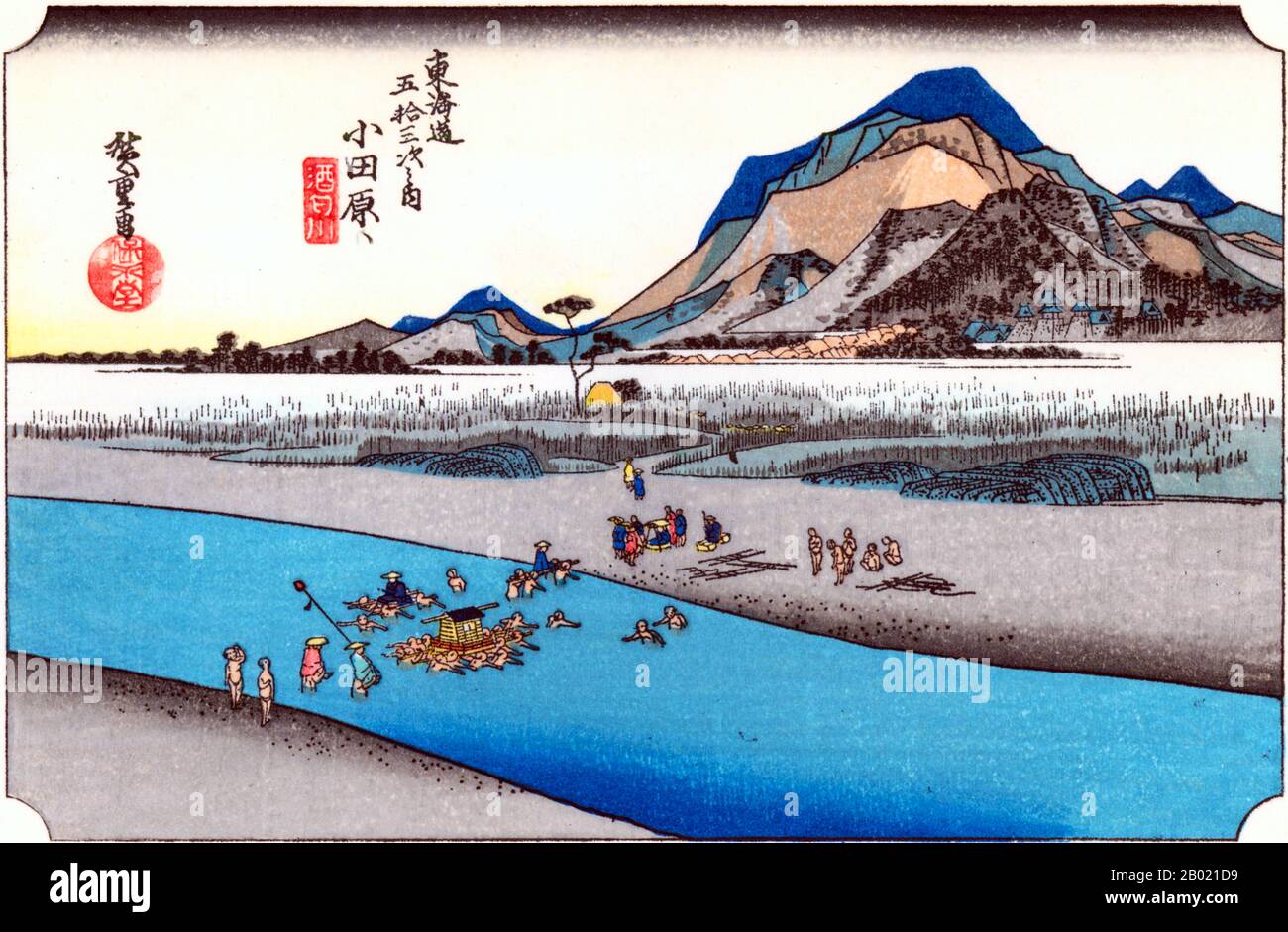 Japan: 'Station Nine: Fording the Sakawa River (Odawara)'. Ukiyo-e woodblock print from the series 'Fifty-three Stations of the Tôkaidô Road' by Utagawa Hiroshige (1797-1858), c. 1833-1834.  Odawara: A daimyo's cortège being carried across the River Sakawa; the background a mass of high, jagged hills, the most distant printed from colour-blocks only.  This station flourished in its position at the entrance to Hakone pass, the most arduous part of the highway. Stock Photo