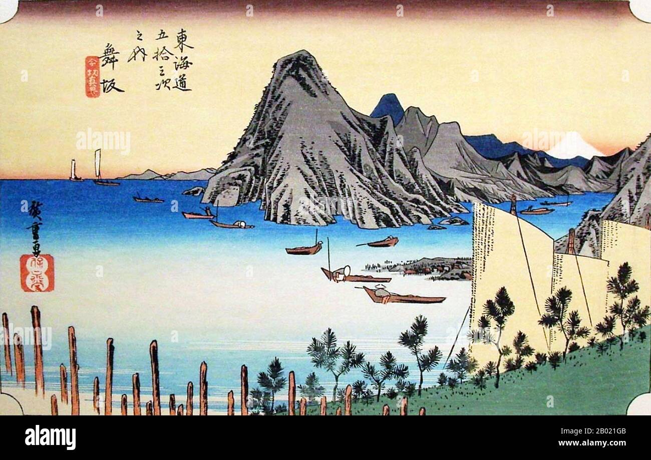 Maisaka: View of Imaki Point jutting out into the sea, and a white Fuji (without outline) in the distance. This station was a fishing port lying on the south-eastern edge of Lake Hamana. Lake Hamana and the Pacific Ocean meet at this point and travellers had to cross this mouth of the lake by boats.  Utagawa Hiroshige (歌川 広重, 1797 – October 12, 1858) was a Japanese ukiyo-e artist, and one of the last great artists in that tradition. He was also referred to as Andō Hiroshige (安藤 広重) (an irregular combination of family name and art name) and by the art name of Ichiyūsai Hiroshige (一幽斎廣重).  The T Stock Photo