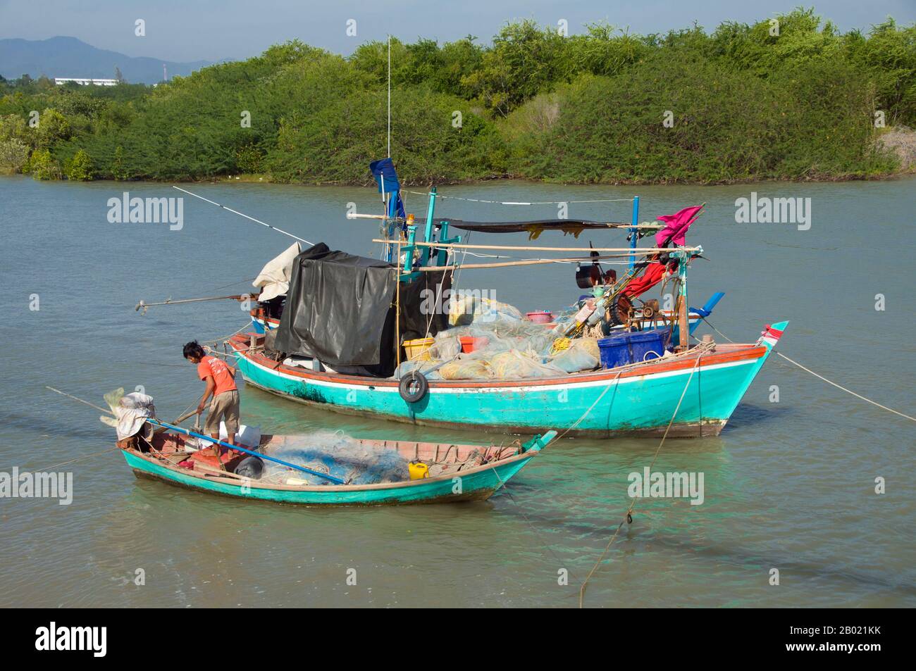 Bang Nang Rom Bay is located between Prachuap Khiri Khan and its satellite beach at Ao Noi. This prosperous Thai fishing village has a reputation for making excellent wooden fishing vessels by hand. Once finished, the boats are either sold to neighbouring fishing communities, or used by local fishermen to catch a prized local fish called ching chang, which is dried and then sold to South Asian buyers. Stock Photo