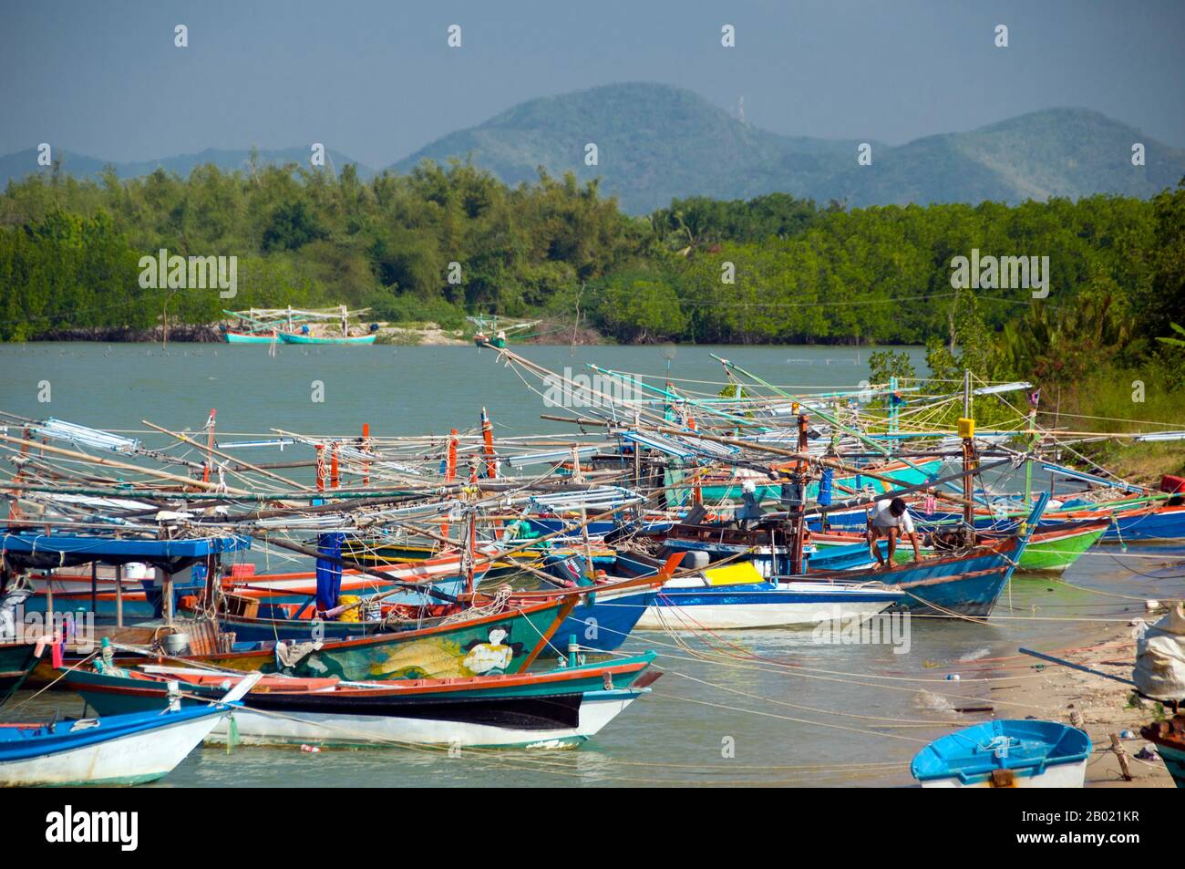 Bang Nang Rom Bay is located between Prachuap Khiri Khan and its satellite beach at Ao Noi. This prosperous Thai fishing village has a reputation for making excellent wooden fishing vessels by hand. Once finished, the boats are either sold to neighbouring fishing communities, or used by local fishermen to catch a prized local fish called ching chang, which is dried and then sold to South Asian buyers. Stock Photo