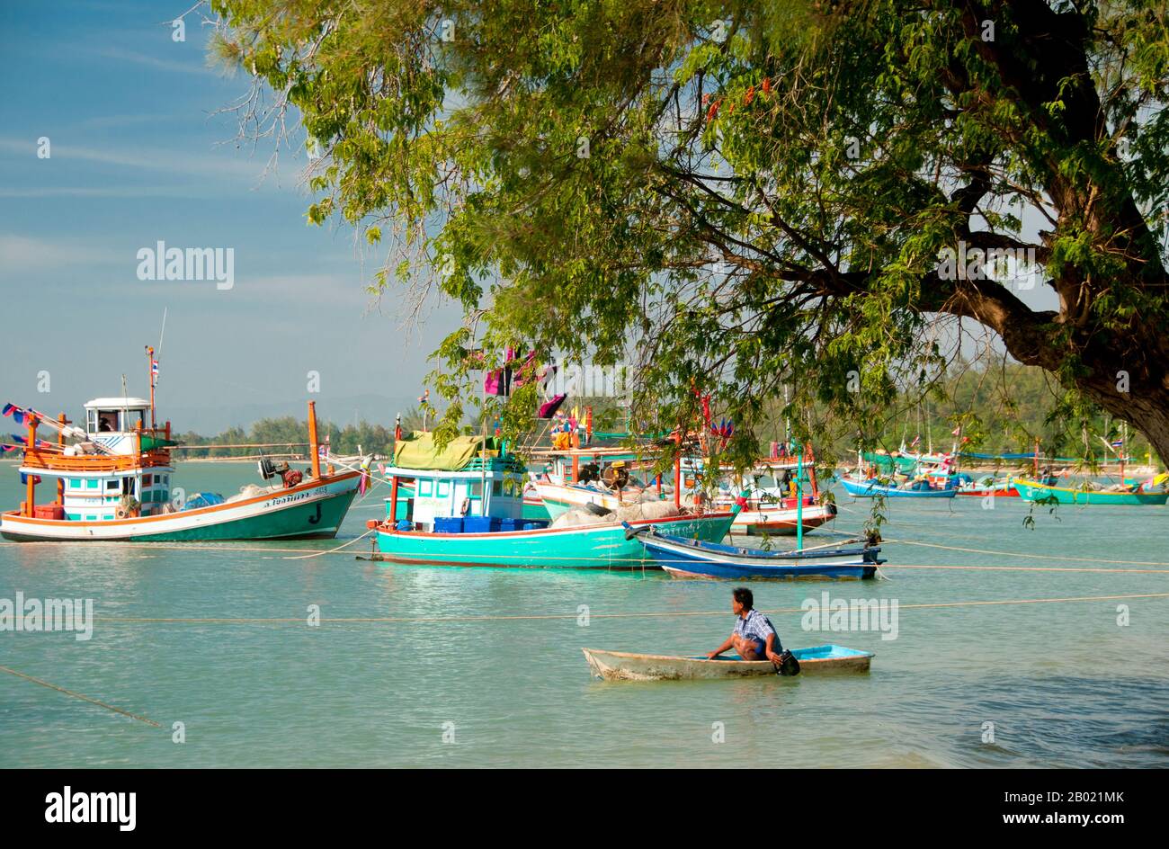 Bang Nang Rom Bay is located between Prachuap Khiri Khan and its satellite beach at Ao Noi. This prosperous Thai fishing village has a reputation for making excellent wooden fishing vessels by hand. Once finished, the boats are either sold to neighbouring fishing communities, or used by local fishermen to catch a prized local fish called ching chang, which is dried and then sold to South Asian buyers. Stock Photo