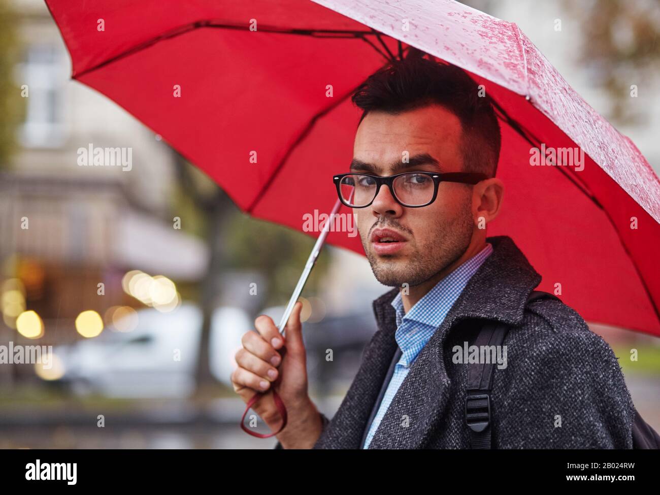 Man black suit umbrella storm hires stock photography and images Alamy