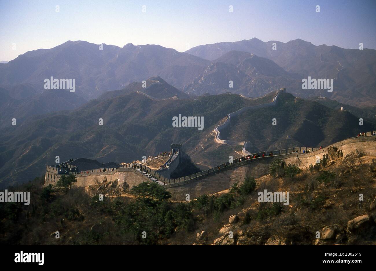 The Great Wall (Wanli Changcheng) is one of mankind's greatest achievements and dates back more than two millennia, when a series of shorter walls were systematically linked during the Qin dynasty (221–206 BCE) to protect China’s northern borders.  The Wall, originally built to keep out barbarian invaders from the north, stretches more than 5,900km (3,700 miles) from the Bohai Gulf in the Yellow Sea to Jiayuguan in the mountains of Gansu province. While the bulk of the wall is now in ruins, some sections have been repaired in recent years.  The Ming rulers, who in 1368 put an end to the alien Stock Photo