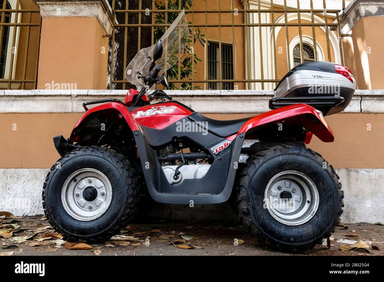 Kymco MXU 150, 4 wheeled quad bike parked in the street. Red colour Stock  Photo - Alamy