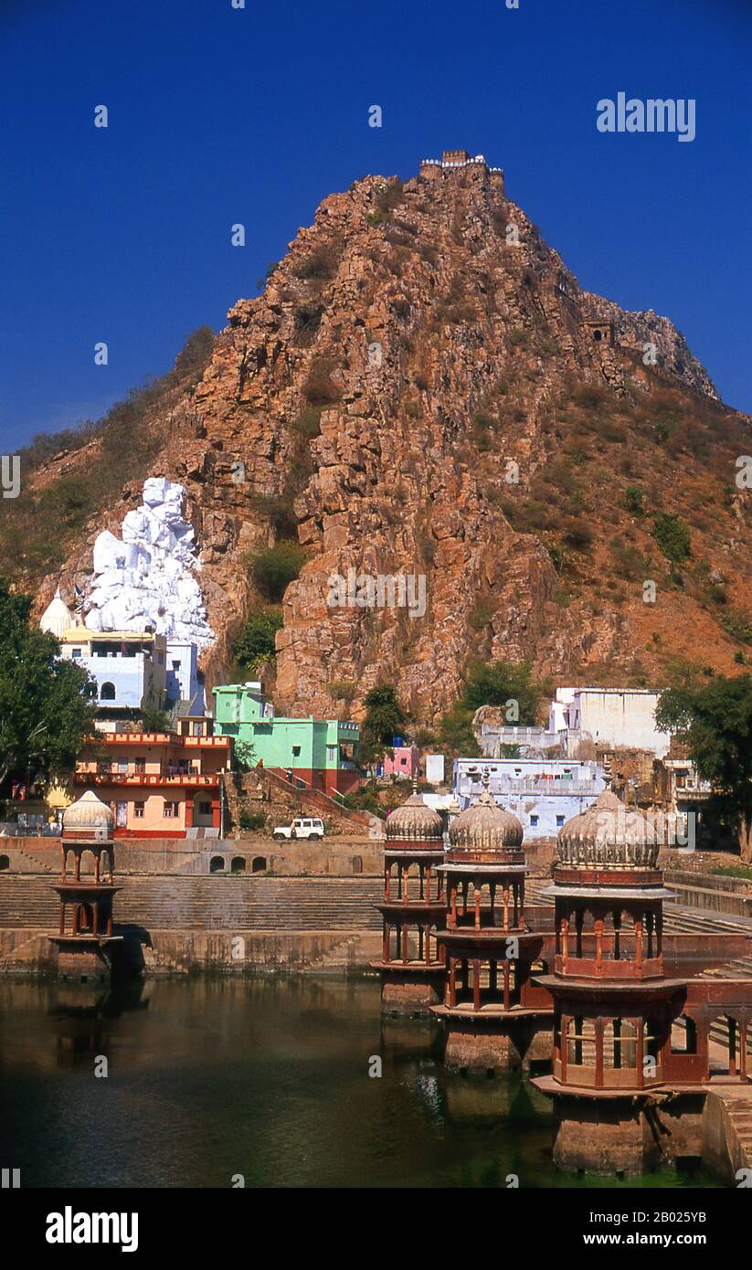 India: The Bala Qila (Alwar Fort) looms above the huge kund (tank) next ...