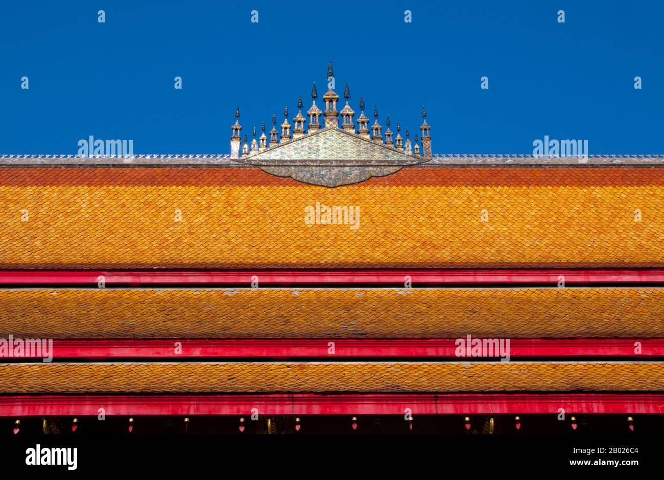 Dok so faa are elaborate temple roof decorations that usually represent the universe and Mount Meru.  Mount Meru (Sanskrit: मेरु), also called Sumeru i.e. the 'Excellent Meru' and Mahameru i.e. 'Great Meru' (Japanese: 須弥山 Shumi-sen), is a sacred mountain in Hindu, Jain as well as Buddhist cosmology and is considered to be the center of all the physical, metaphysical and spiritual universes. It is also the abode of Lord Brahma and the Demi-Gods (Dev).   Wat Nong Sikhounmuang (Sikhunmuang) was originally built in 1729. It was burnt down in 1774, but the bronze Buddha statue that can still be fou Stock Photo
