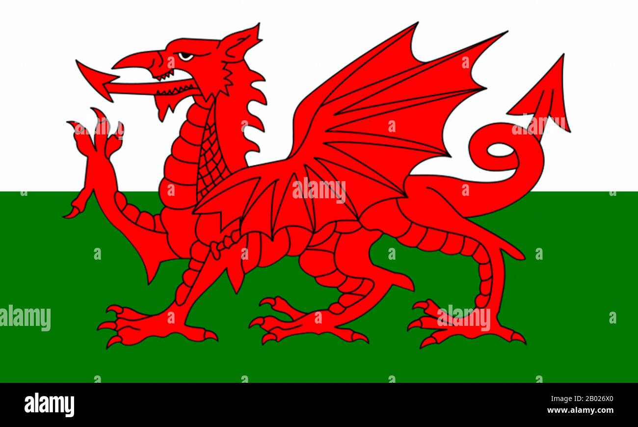 The flag of Wales (Welsh: Baner Cymru or Y Ddraig Goch, meaning 'The Red Dragon') consists of a red dragon passant on a green and white field. As with many heraldic charges, the exact representation of the dragon is not standardised and many renderings exist.  The flag incorporates the Red Dragon of Cadwaladr, King of Gwynedd, along with the Tudor colours of green and white. It was used by Henry VII at the Battle of Bosworth Field in 1485 after which it was carried in state to St Paul's Cathedral. The red dragon was then included as a supporter of the Tudor royal arms to signify their Welsh de Stock Photo