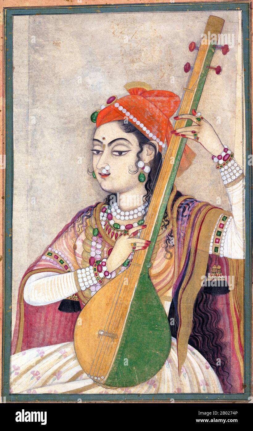 The tambura, tanpura, tamboura or taanpura or tanipurani is a long-necked plucked lute (a stringed instrument found in different forms and in many places). The body shape of the tambura somewhat resembles that of the sitar, but it has no frets – and the strings are played open.  One or more tamburas may accompany other musicians or vocalists. It has four or five (rarely six) wire strings, which are plucked one after another in a regular pattern to create a harmonic resonance on the basic note (bourdon or drone function). An electronic tanpura is often substituted in contemporary Indian classic Stock Photo