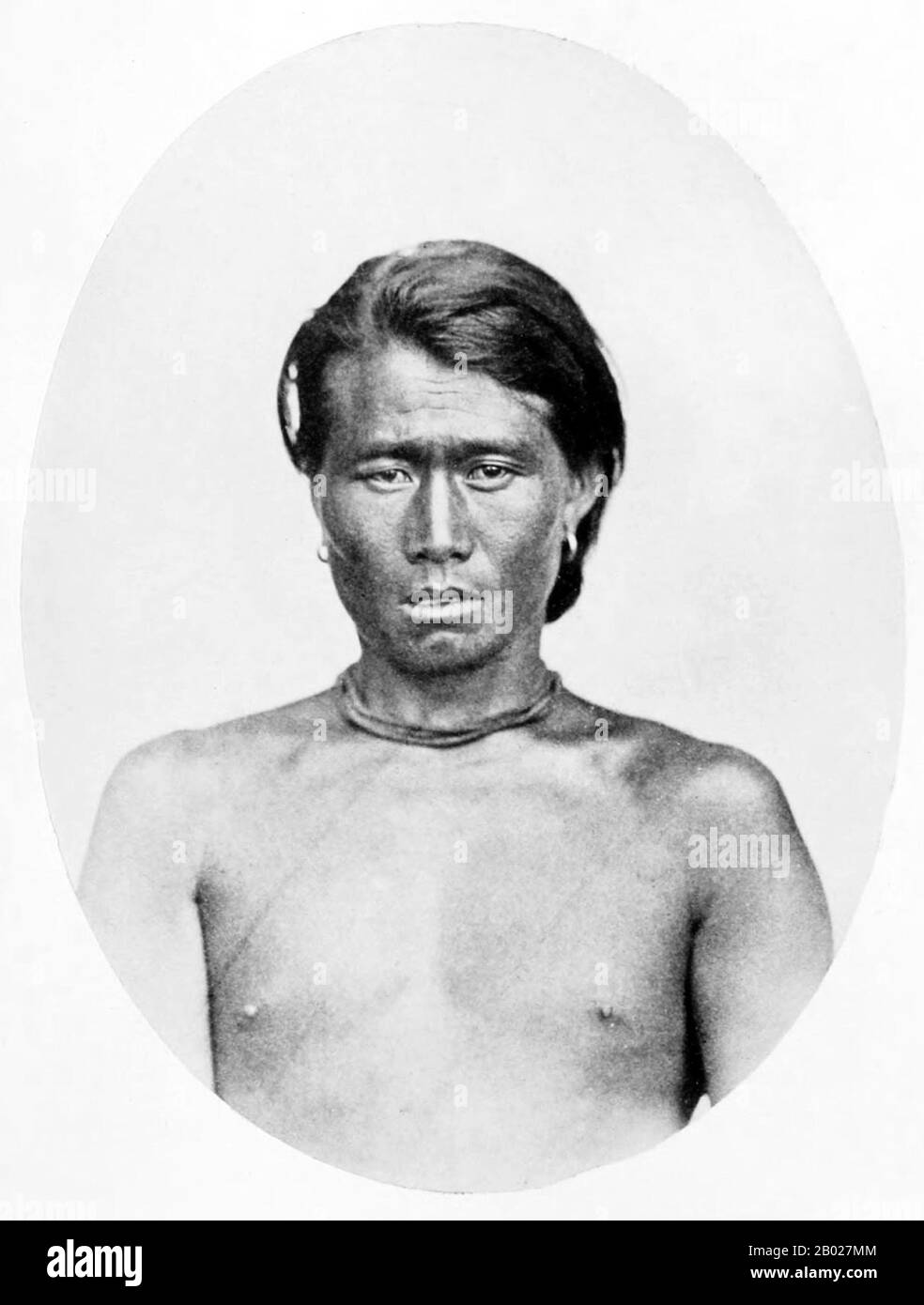 India: 'Marauding Tribe: Hill Naga, Munnipore (Manipur)'. Early British colonial photograph, 1868-1875.  The term Naga people refers to a conglomeration of several tribes inhabiting the North Eastern part of India and north-western Burma. The tribes have similar cultures and traditions, and form the majority ethnic group in the Indian states of Nagaland, Manipur, Arunachal Pradesh and Assam.  The Naga speak various distinct languages, which each belong to branches of Tibeto-Burman, including Angami–Pochuri, Ao, Kukish, Sal, Tangkhul and Zeme. Stock Photo