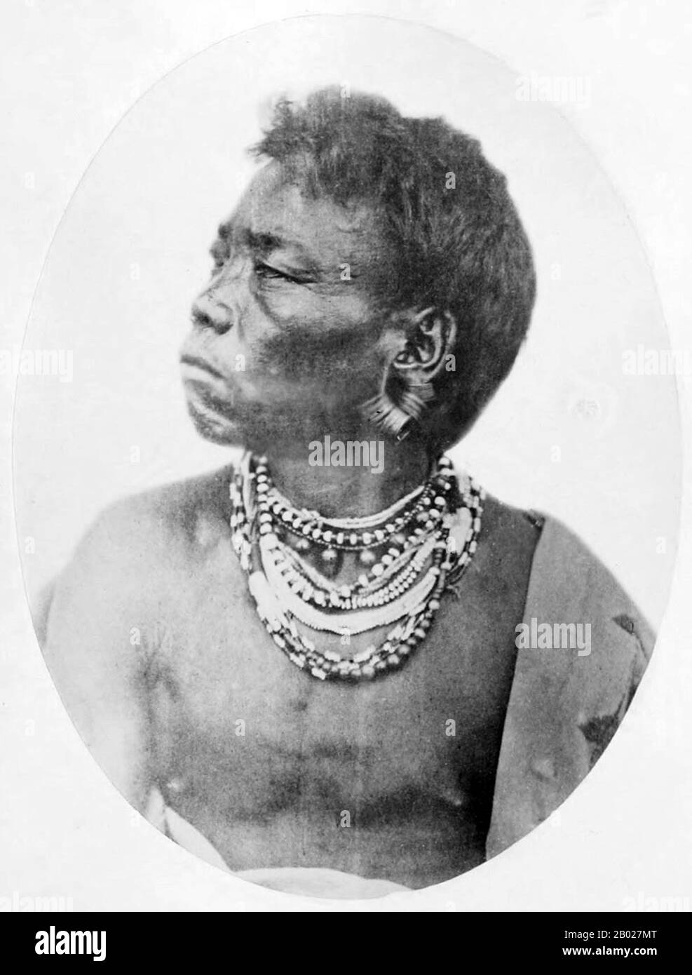 India: 'Marauding Tribe: Hill Naga, Cachar'. Early British colonial photograph, 1868-1875.  The term Naga people refers to a conglomeration of several tribes inhabiting the North Eastern part of India and north-western Burma. The tribes have similar cultures and traditions, and form the majority ethnic group in the Indian states of Nagaland, Manipur, Arunachal Pradesh and Assam.  The Naga speak various distinct languages, which each belong to branches of Tibeto-Burman, including Angami–Pochuri, Ao, Kukish, Sal, Tangkhul and Zeme. Stock Photo