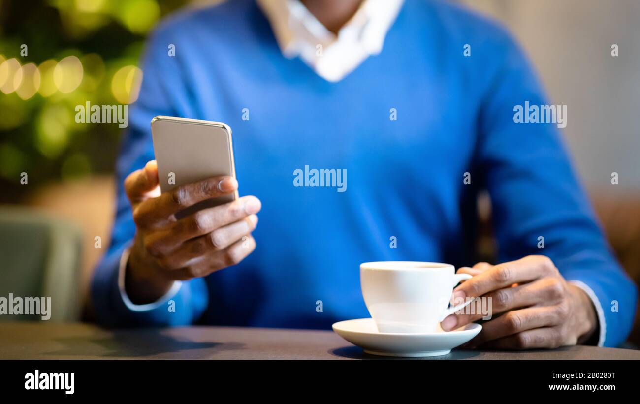 Close up of young man using his cell phone Stock Photo