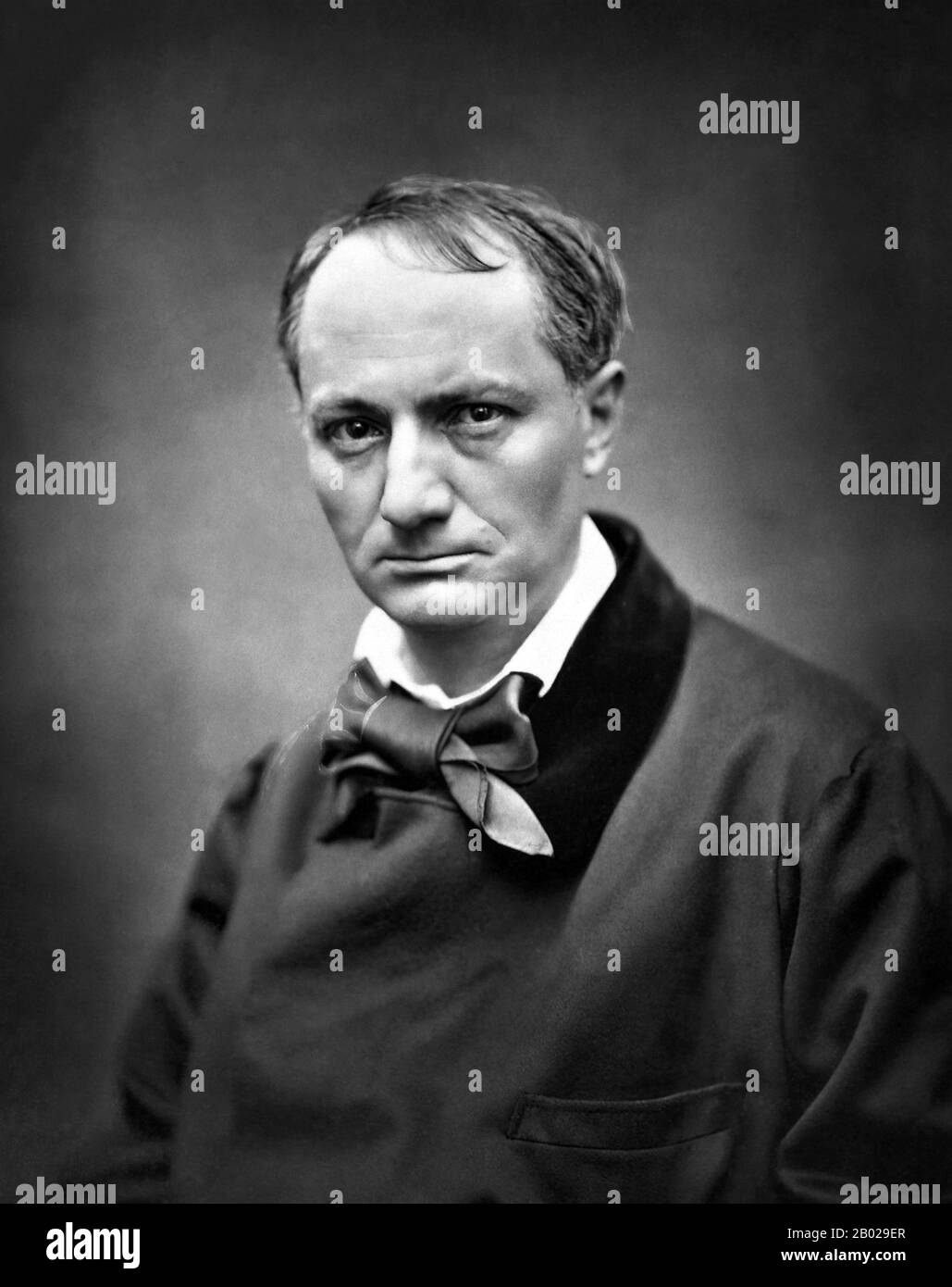 Charles Pierre Baudelaire (April 9, 1821 – August 31, 1867) was a French poet who produced notable work as an essayist, art critic, and pioneering translator of Edgar Allan Poe. His most famous work, Les Fleurs du mal (The Flowers of Evil), expresses the changing nature of beauty in modern, industrializing Paris during the 19th century.  Baudelaire's highly original style of prose-poetry influenced a whole generation of poets including Paul Verlaine, Arthur Rimbaud and Stéphane Mallarmé among many others. He is credited with coining the term 'modernity' (modernité) to designate the fleeting, e Stock Photo