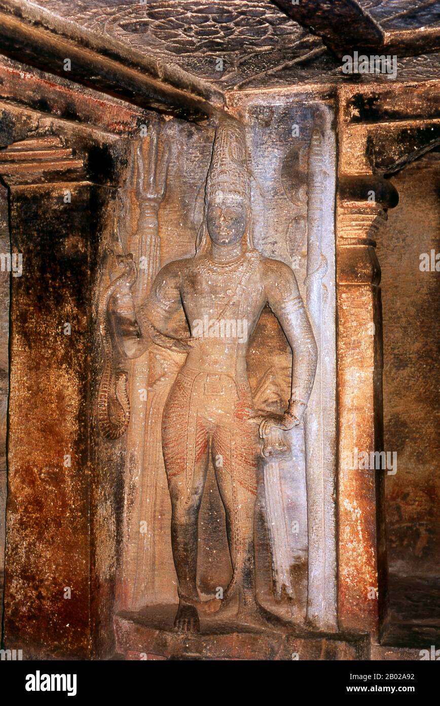 Ravana Phadi cave temple is one of the oldest rock cut temples in Aihole and dates back to the 6th century CE. It is dedicated to the Hindu god Shiva. The cave contains a Shivalinga in the inner room or sanctum sanctorum. The sanctum has a vestibule with a triple entrance and has carved pillars. The walls and sides of the temple are covered with large figures including a figure of Nataraja (Shiva) dancing, surrounded by the Saptamatrikas (Seven Mothers). Stock Photo