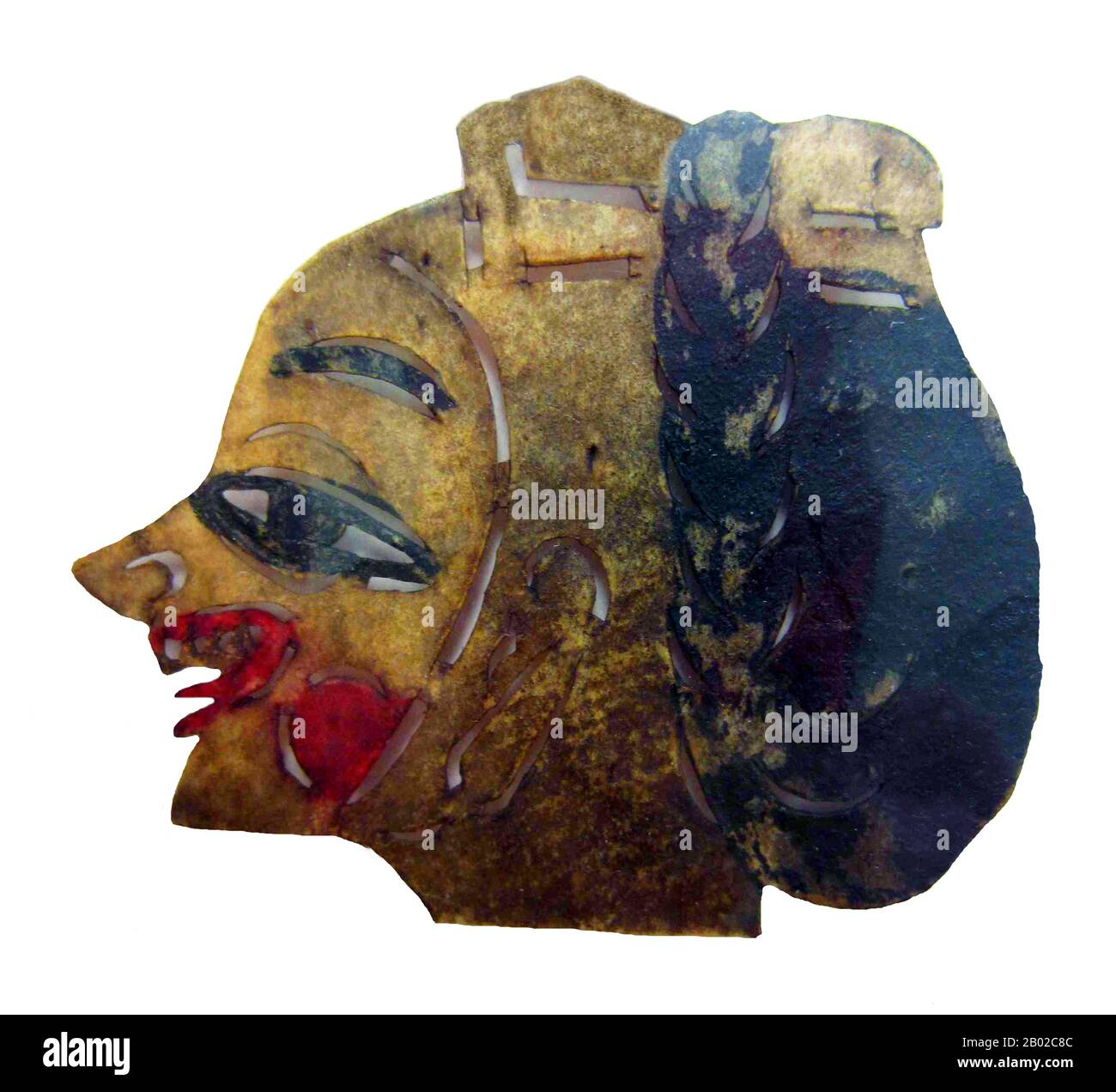China: Head of a female shadow puppet, Gansu Province, late Qing Dynasty period.  Shadow play (Chinese: pí yĭng xì) or shadow puppetry is an ancient form of storytelling and entertainment using opaque, often articulated figures in front of an illuminated backdrop to create the illusion of moving images. It is popular in various cultures. At present, more than 20 countries are known to have shadow show troupes.  Shadow puppetry originated during the Han Dynasty when one of the concubines of Emperor Wu of Han died from an illness. Stock Photo