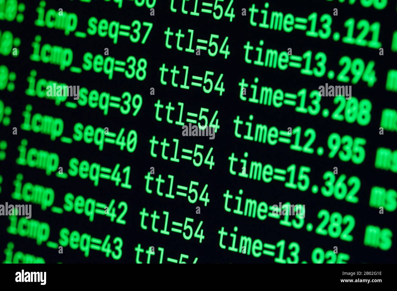 Green text on black background ping ttl terminal CLI command line hacker Stock Photo