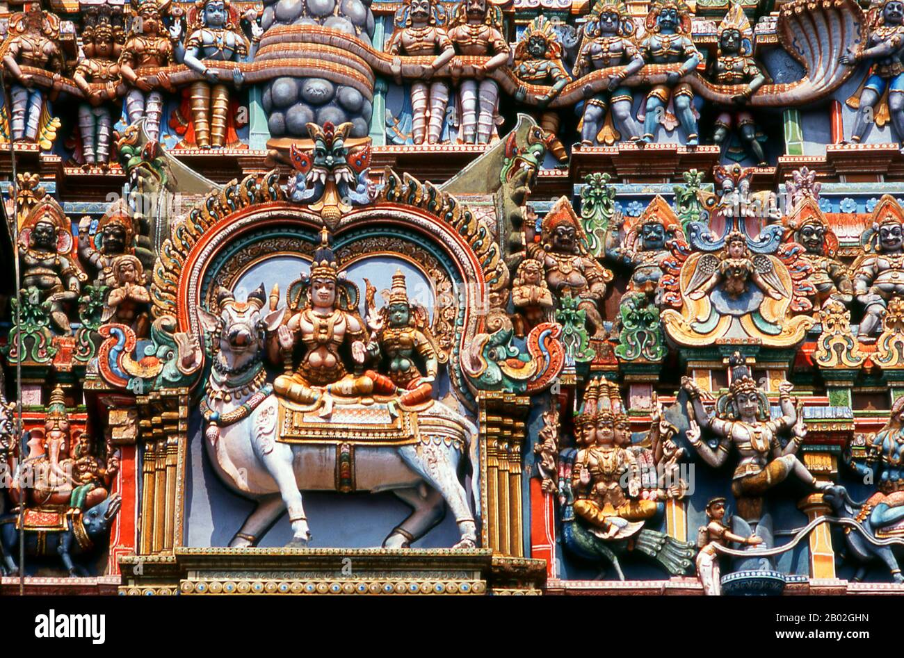 India: Hundreds of figures adorn one of the 14 'gopuram' (gateway towers) at Meenakshi Amman Temple, Madurai, Tamil Nadu.  The Meenakshi Amman Temple (also called: Meenakshi Sundareswarar Temple, Tiru-aalavaai and Meenakshi Amman Kovil) is a Hindu temple dedicated to Parvati, known as Meenakshi, and her consort, Shiva, here named Sundareswarar. The present temple dates from between 1623 and 1655 CE. Stock Photo