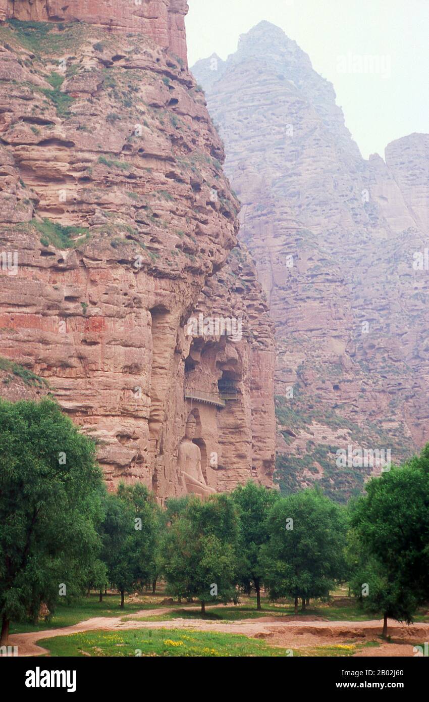 Binglingsi Shiku (Thousand Buddha Caves) is a collection of caves and grottoes set in an inaccessible canyon by the Yellow River about 80km upstream from Lanzhou. The site's very isolation has protected and preserved Binglingsi, not least from marauding Red Guards during the Cultural Revolution (1966 - 76).  The first Buddhist grottoes at Binglingsi date from the Eastern Jin Dynasty (c. 317 - 420 CE), and construction continued for well over a thousand years throughout the Tang, Song, Ming and Qing eras.  The Bingling caves were often sponsored by wealthy patrons investing some of their Silk R Stock Photo