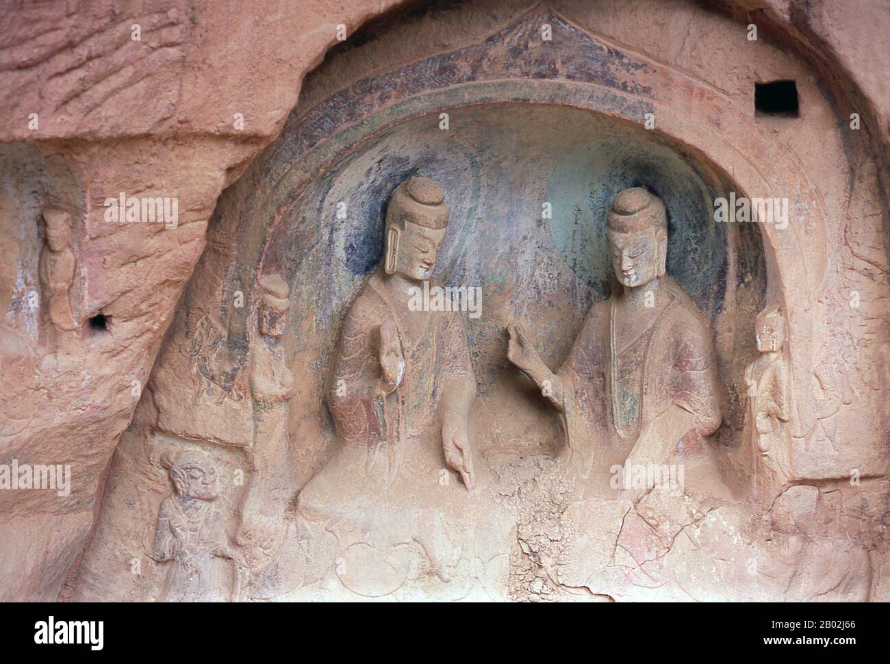 China: Buddhist stone relief carved into the rock face, Binglingsi, Yongjing County, Linxia Hui Autonomous Prefecture, Gansu.  Binglingsi Shiku (Thousand Buddha Caves) is a collection of caves and grottoes set in an inaccessible canyon by the Yellow River about 80km upstream from Lanzhou. The site's very isolation has protected and preserved Binglingsi, not least from marauding Red Guards during the Cultural Revolution (1966-1976).  The first Buddhist grottoes at Binglingsi date from the Eastern Jin Dynasty (c. 317-420 CE), and construction continued for well over a thousand years. Stock Photo