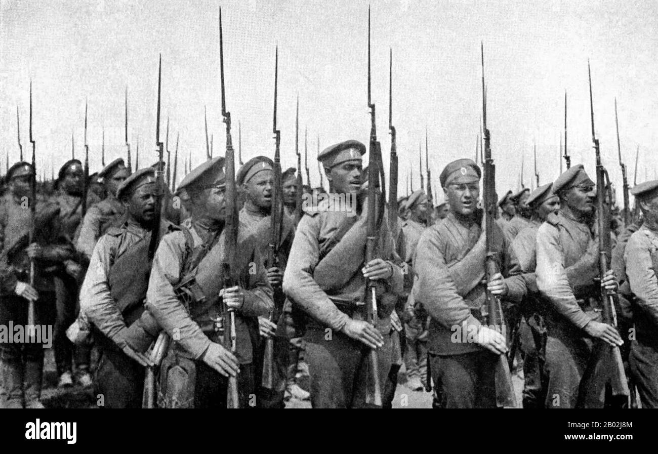 Russia: Russian Imperial infantry from the White Volunteer Army armed with Mosin-Nagant rifles, 1920.  World War One was to have a devastating impact on Russia. When World War One started in August 1914, Russia responded by patriotically rallying around Nicholas II.  Military disasters at the Masurian Lakes and Tannenburg greatly weakened the Russian Army in the initial phases of the war. The growing influence of Gregory Rasputin over the Romanovs did a great deal to damage the royal family and by the end of the spring of 1917, the ruling Romanovs were overthrown. Stock Photo