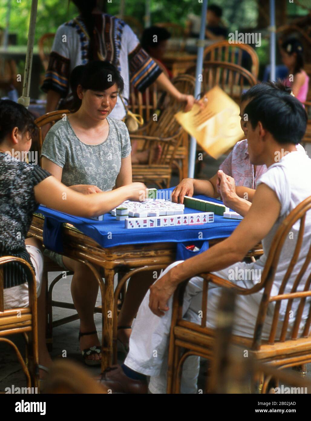 Mahjong is a game that originated in China, commonly played by four players (with some three-player variations found in Korea and Japan). Similar to the Western card game rummy, mahjong is a game of skill, strategy and calculation and involves a certain degree of chance. In Asia, mahjong is also popularly played as a gambling game (though it may just as easily be played recreationally).  The game is played with a set of 136 tiles based on Chinese characters and symbols, although some regional variations use a different number of tiles. In most variations, each player begins by receiving thirte Stock Photo