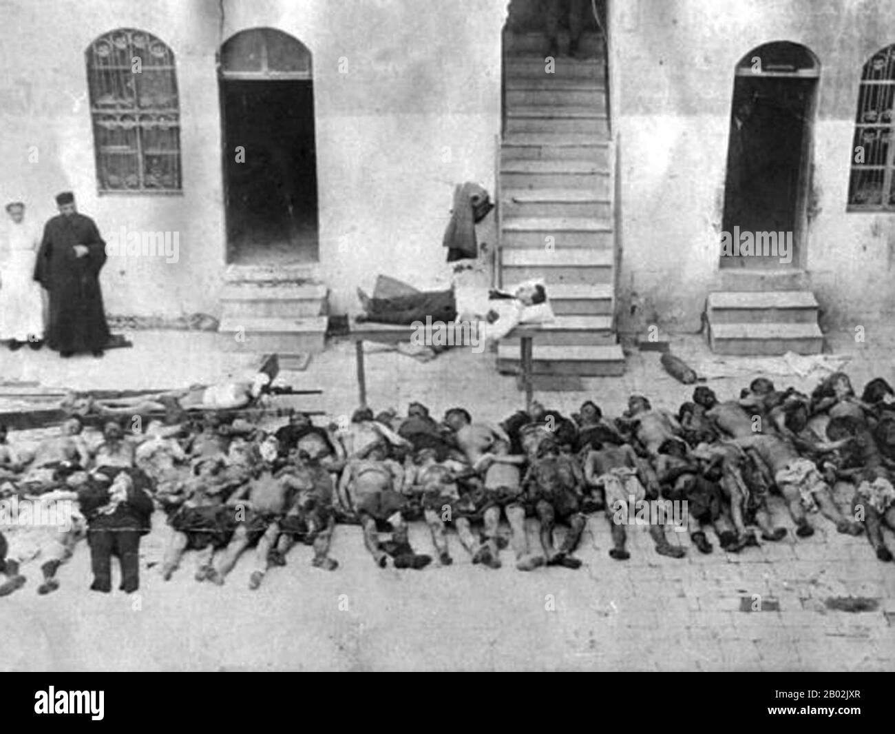 Syria / Turkey / Armenia: The corpses of Armenian victims of the genocide laid out in a courtyard, Aleppo, 1919. The Armenian Genocide refers to the deliberate and systematic destruction of the Armenian population of the Ottoman Empire during and just after World War I. It was implemented through wholesale massacres and deportations, with the deportations consisting of forced marches under conditions designed to lead to the death of the deportees. The total number of resulting Armenian deaths is generally held to have been between one and one and a half million. Stock Photo