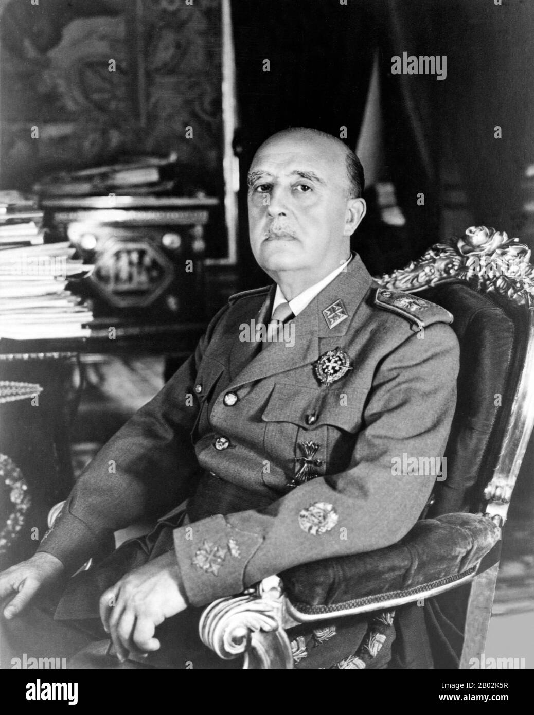 Francisco Franco Bahamonde (4 December 1892 – 20 November 1975) was the dictator of Spain from 1939 to his death in 1975.  A conservative, he was shocked when the monarchy was removed and replaced with a democratic republic in 1931. With the 1936 elections, the conservatives fell and the leftist Popular Front came to power. Looking to overthrow the republic, Franco and other generals staged a partially successful coup, which started the Spanish Civil War. With the death of the other generals, Franco quickly became his faction's only leader.  Franco received military support from local fascist, Stock Photo