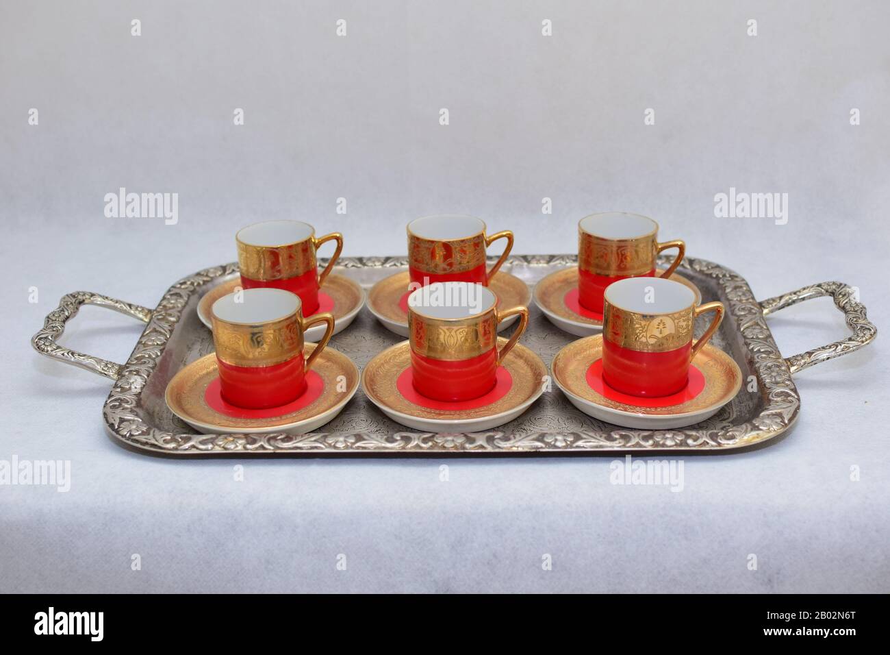 Mock up / design set of elegant and traditional colorful Red and gold traditional coffee cup & Tea cup on cup's plate , drinkware Stock Photo