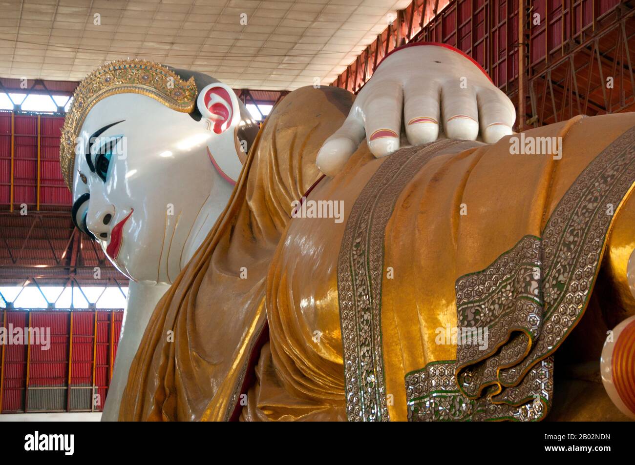 Housed in a pavilion the 70m (230ft) long Chauk Htat Gyi reclining Buddha was constructed in 1966. It replaced a smaller image built in 1907. Stock Photo