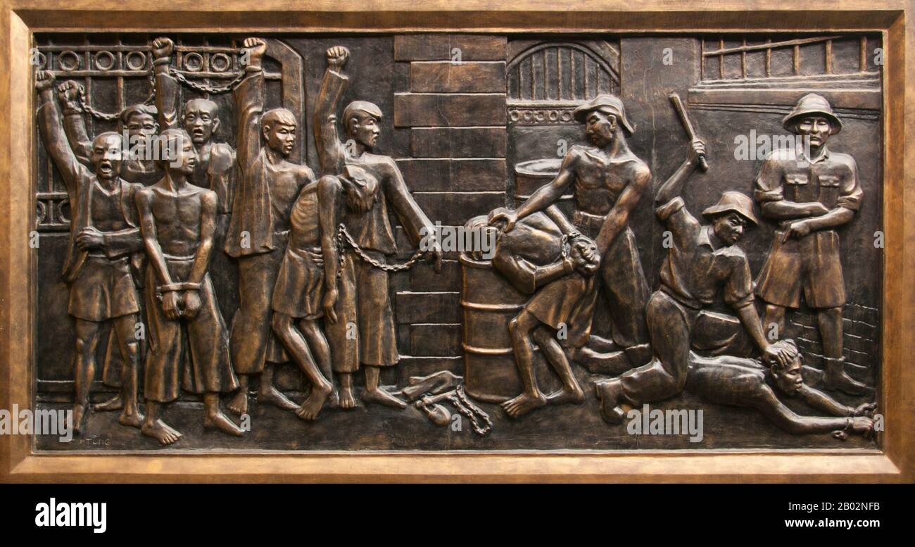Vietnam: Bas-relief showing torture and brutality by the French colonialists within the prison, Hoa Lo Prison Museum (the old French Maison Centrale), Hanoi. The French colonial administration built Hoa Lo Prison in 1896. Originally intended to hold 450 prisoners, by the 1930s the number of detainees had soared to almost 2,000, the great majority political prisoners.  Hoa Lo Prison achieved notoriety during the Second Indochina War as a place of incarceration for downed US pilots, who ironically nicknamed the prison the ‘Hanoi Hilton’. Stock Photo