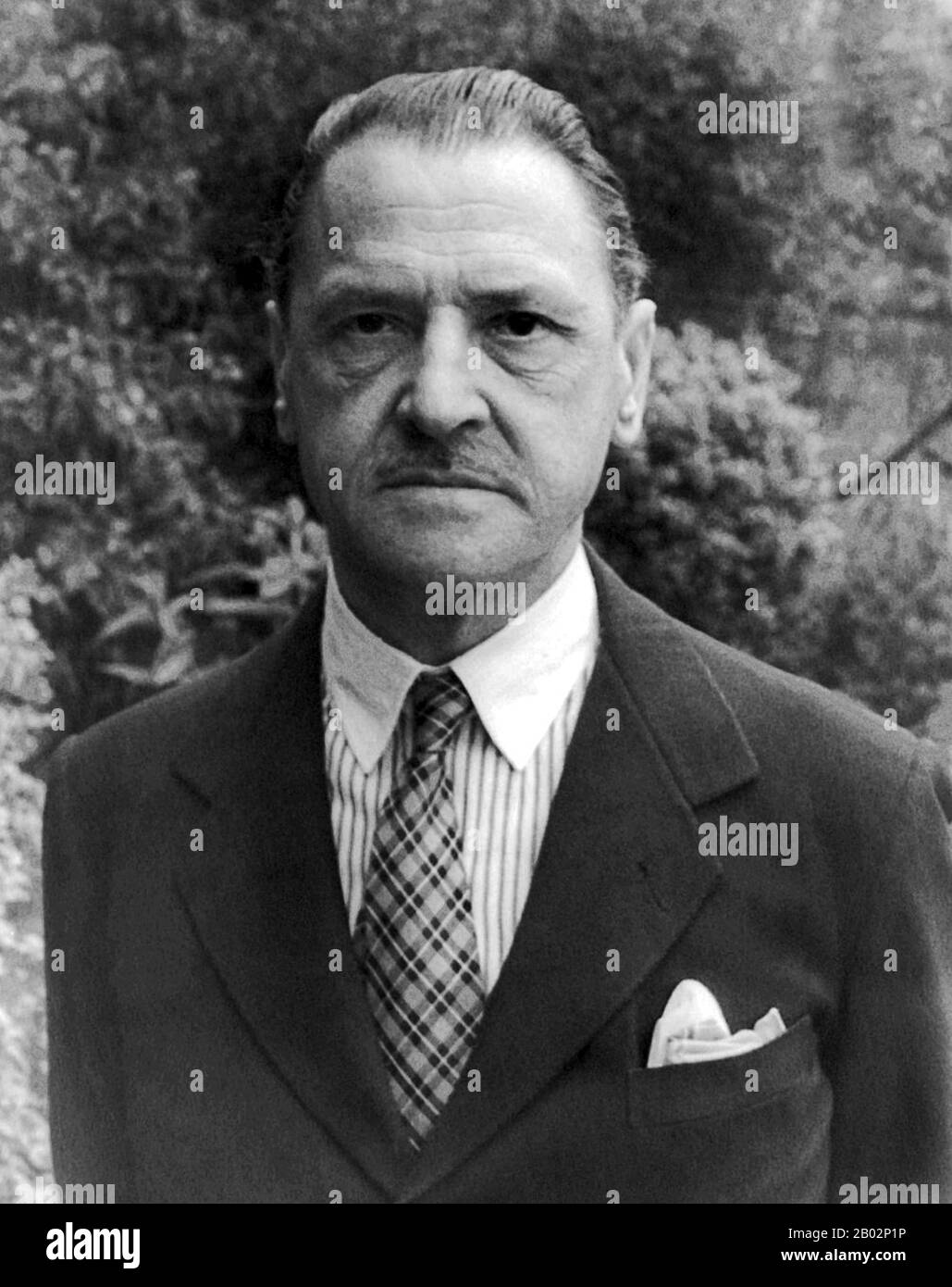 William Somerset Maugham (25 January 1874 – 16 December 1965) was a British playwright, novelist and short story writer. He was among the most popular writers of his era and reputedly the highest paid author during the 1930s.  Among his short stories, some of the most memorable are those dealing with the lives of Western, mostly British, colonists in the Far East. They typically express the emotional toll the colonists bear by their isolation. 'Rain', 'Footprints in the Jungle', and 'The Outstation' are considered especially notable.  Maugham was one of the most significant travel writers of t Stock Photo