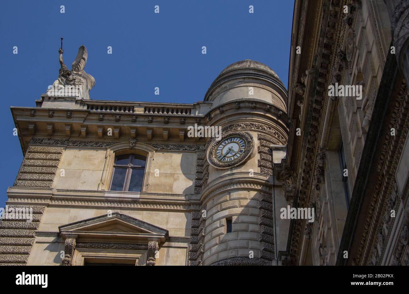 Inset clock on Louvre building Stock Photo