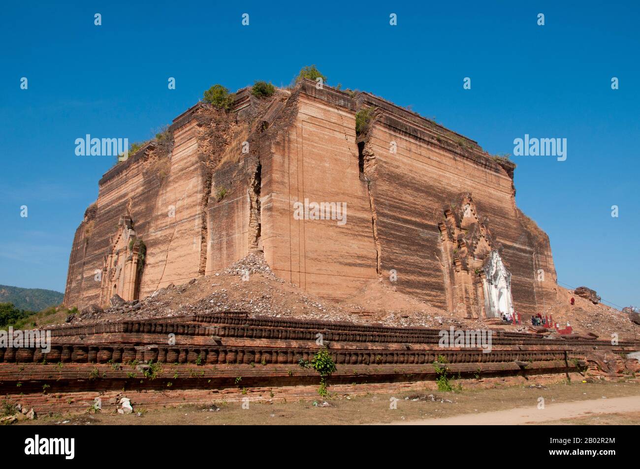 The Mingun Pahtodawgyi (Mingun Temple) was built in 1790 by King Bowdawpaya (1745 - 1819) the sixth king of the Konbaung Dyanasty. The enormous stupa was never completed and today stands at a height of 50m (164 ft). It was originally intended to be the tallest stupa in the world at a height of 150m (490 ft). Stock Photo