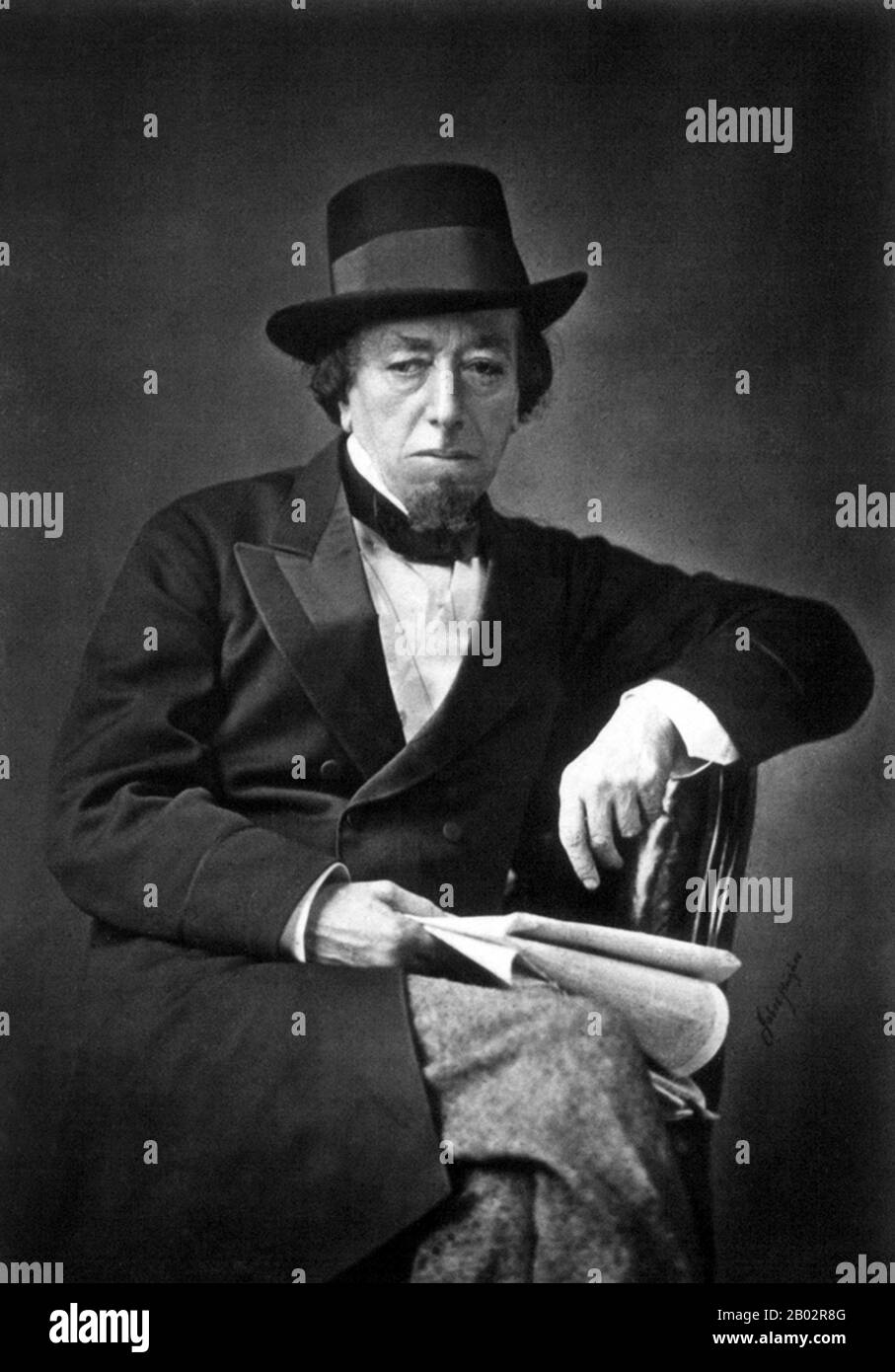 Benjamin Disraeli, 1st Earl of Beaconsfield, KG, PC, FRS, (21 December 1804 – 19 April 1881) was a British Conservative politician, writer and aristocrat who twice served as Prime Minister. He played a central role in the creation of the modern Conservative Party, defining its policies and its broad outreach.  Disraeli is remembered for his influential voice in world affairs, his political battles with the Liberal leader William Ewart Gladstone, and his one-nation conservatism or 'Tory democracy'. He made the Conservatives the party most identified with the glory and power of the British Empir Stock Photo
