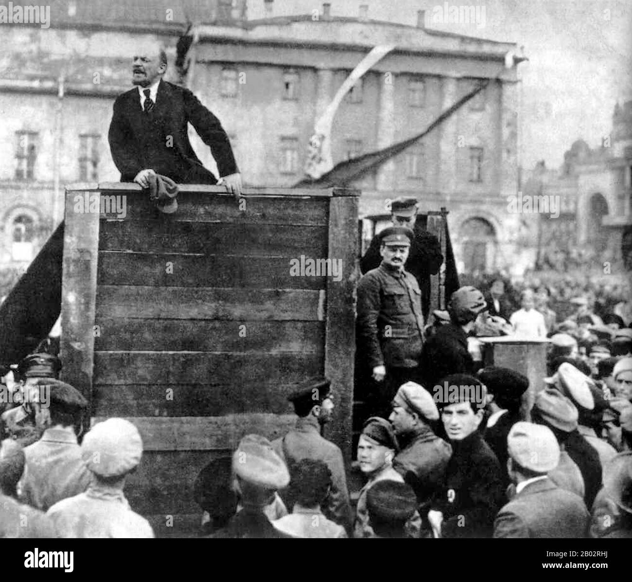 Lenin speaking at an assemble of Red Army troops bound for the Polish front. Photograph taken in Sverdlov Square, Moscow, on 5 May 1920.  This is the original image with Trotsky and Kamenev standing on the steps of the platform; later versions produced under Stalin's administration had them removed. Stock Photo
