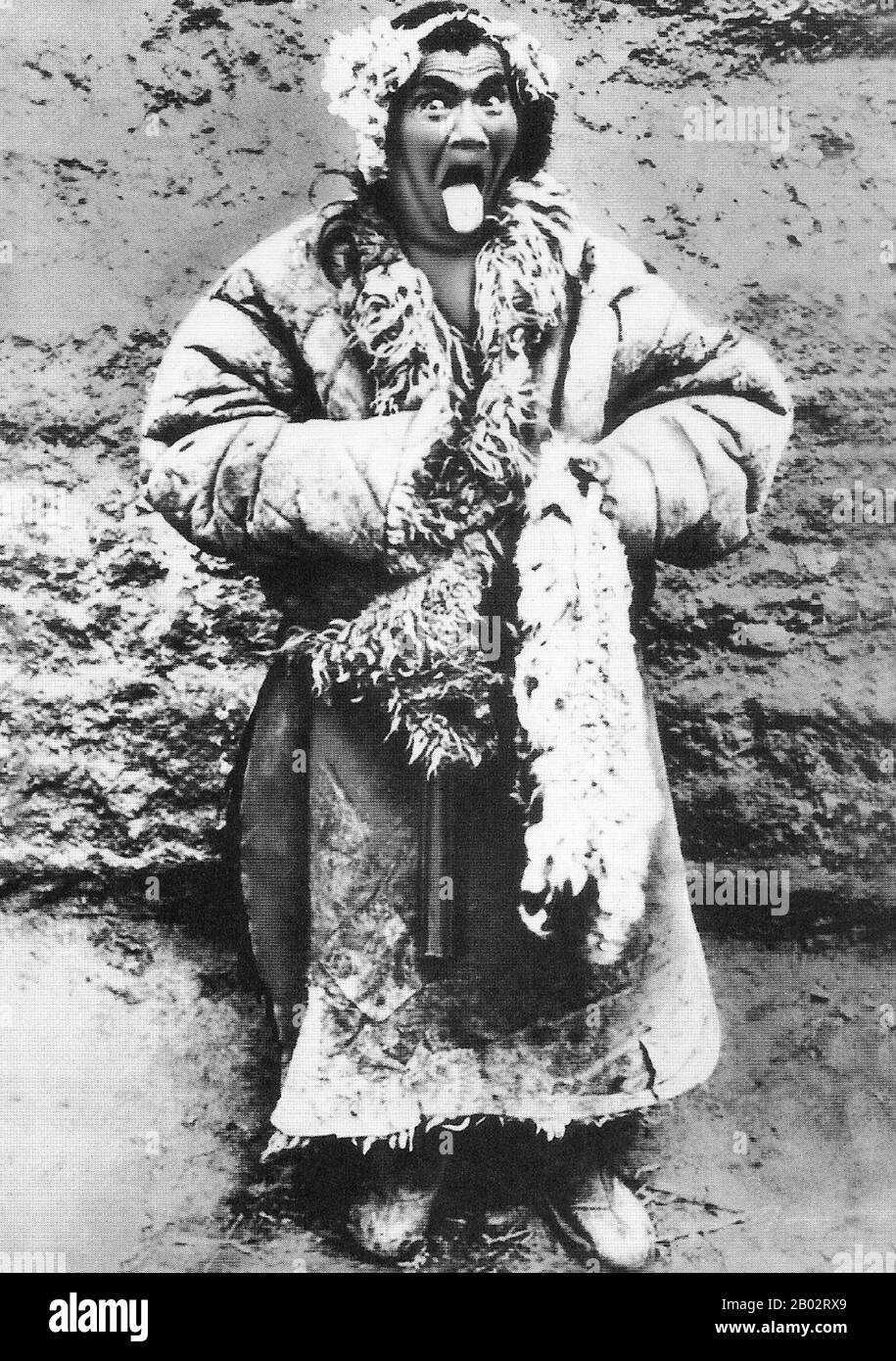 In Tibet sticking the tongue out is considered a polite way of showing respect. The caption on this photograph explains:  'Sticking the tongue out as a Tibetan greeting began when Buddhists wanted people to know that they were not Bon-Po (pre-Buddhist religion) as they were supposed to have black tongues. Pink tongues were stuck out as proof of being Buddhist. The further the tongue out, the greater respect'. Stock Photo