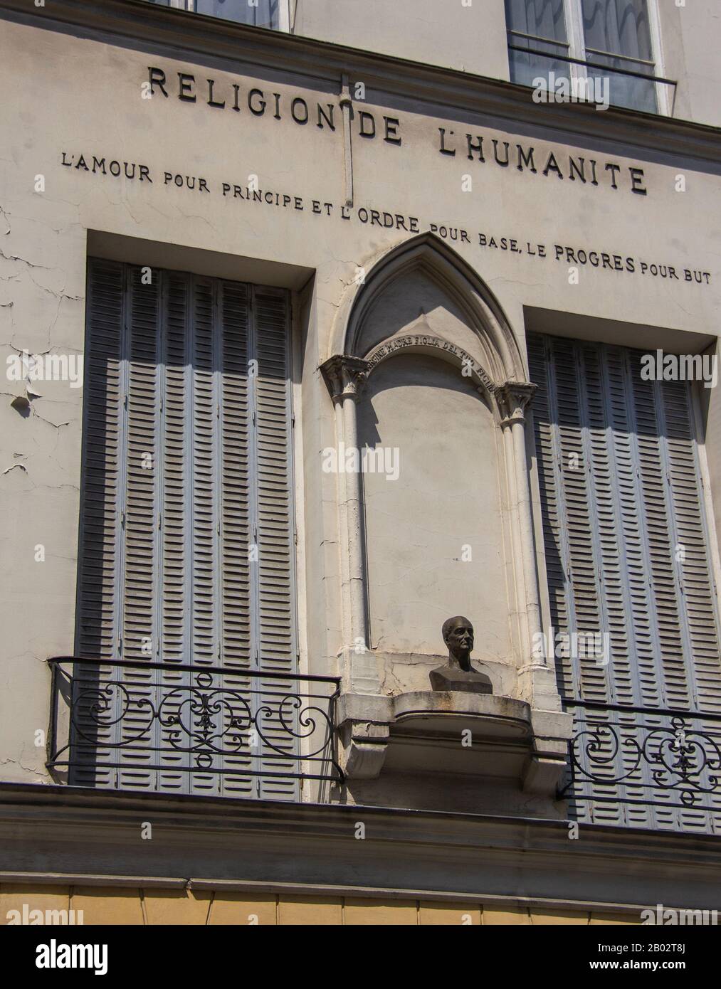 Bust between 2 windows Paris Stock Photo