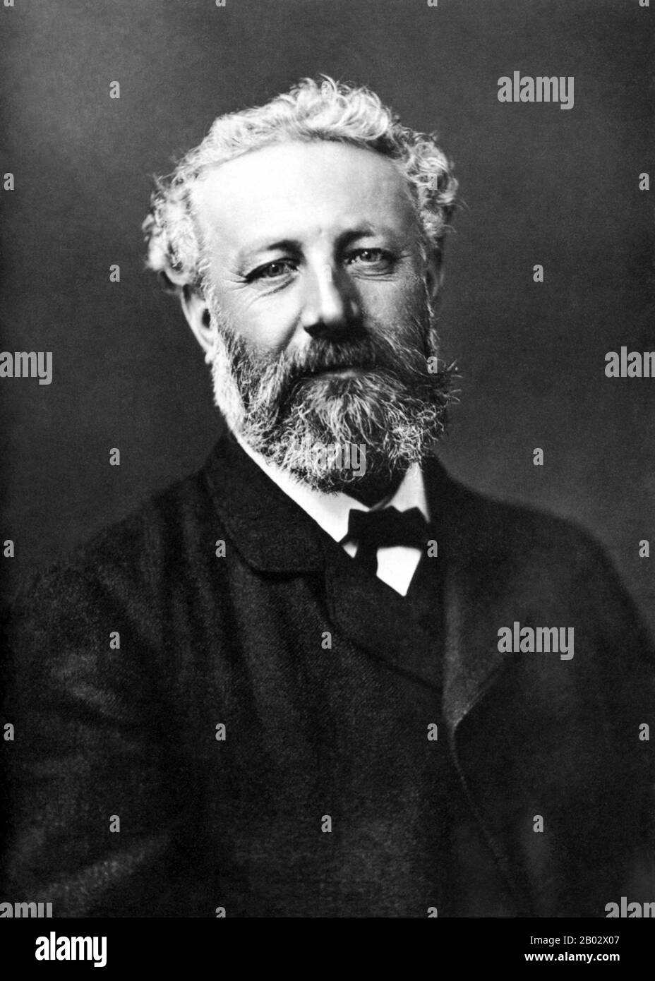 Jules Gabriel Verne (8 February 1828 – 24 March 1905) was a French novelist, poet, and playwright best known for his adventure novels and his profound influence on the literary genre of science fiction.  Verne was born to bourgeois parents in the seaport of Nantes, where he was trained to follow in his father's footsteps as a lawyer, but quit the profession early in life to write for magazines and the stage. His collaboration with the publisher Pierre-Jules Hetzel led to the creation of the Voyages Extraordinaires, a widely popular series of scrupulously researched adventure novels including J Stock Photo