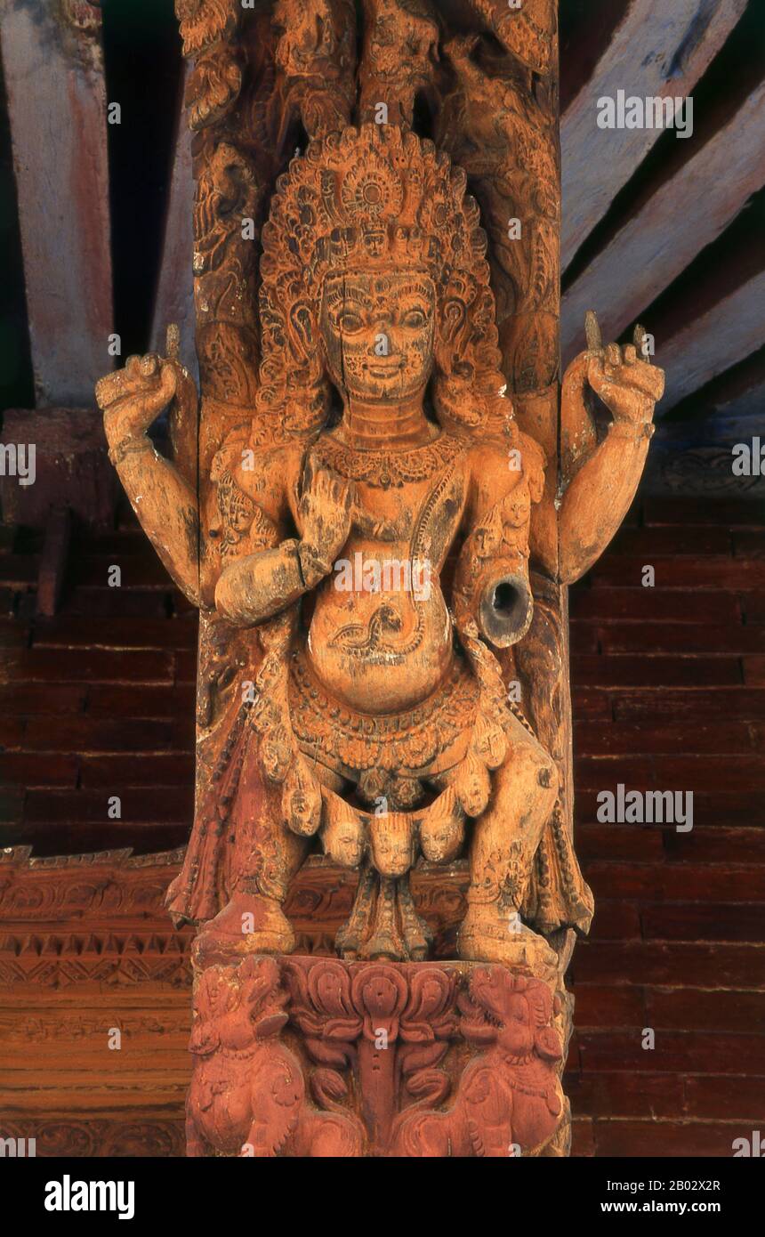 Woodcarvings have been an integral part of houses and temples in Nepal since the 12th century and the art reached its peak during the 15th and 16th centuries CE. Wood being an abundant raw material, woodcarvings were simply everywhere: wooden doors, windows, cornices, pillars, struts or beams in Newar houses were all adorned with complex ornamental patterns. Temples, too, received a generous share of attention, but here, naturally, religious motifs were dominant.  The woods of various trees were employed, including sisu, champa, deodar, haldu and teak; but the most favoured wood was that of th Stock Photo