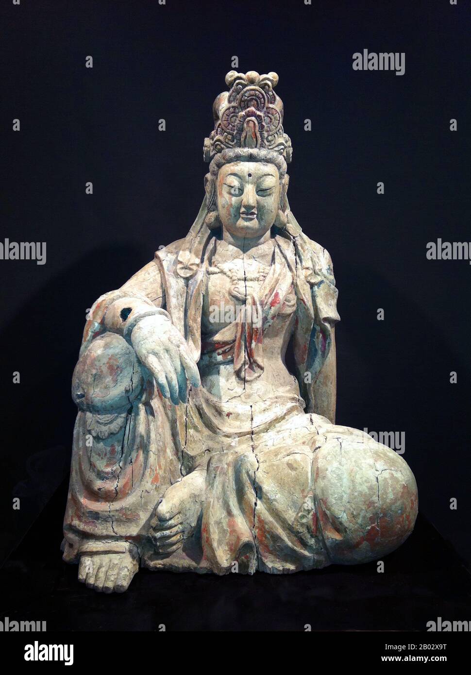 China: Wooden image of Guanyin, the Goddess of Mercy. Ming Dynasty (1368-1644). Guanshiyin or Avalokitesvara is the bodhisattva associated with compassion as venerated by East Asian Buddhists, usually as a female. The name Guanyin is short for Guanshiyin which means 'Observing the Sounds (or Cries) of the World'. It is generally accepted (in the Chinese community) that Guanyin originated as the Sanskrit Avalokitesvara, which is her male form. Commonly known in English as the Goddess of Mercy, Guanyin is also revered in Daoism as an Immortal.In Japan, Guanyin is called Kannon. Stock Photo