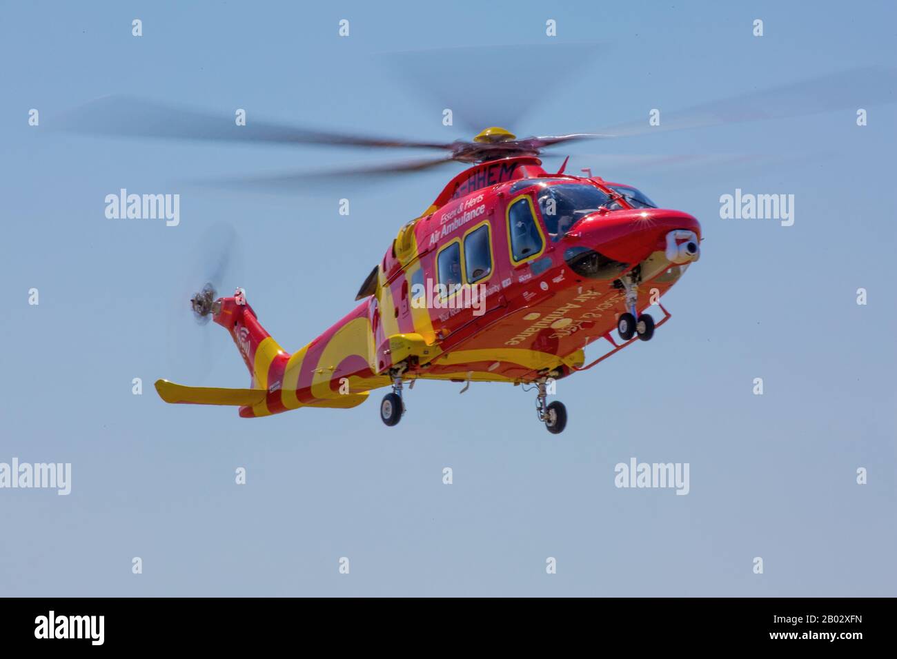 Leonardo AW169 Essex and Herts Air Ambulance taking off from it's base at North Weald airfield Stock Photo