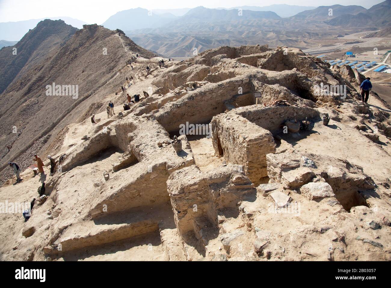 About 30 kms from Kabul, Mes Aynak, is a trove of Buddhist monastery ruins, statues, and stupas attesting to the prolific role that Afghanistan played in the proliferation of Buddhism in Central and East Asia. Currently being excavated as a copper mine, rescue excavations began in 2009. Work was undertaken by the National Institute of Archaeology and the Delegation Archeologique Francaise en Afghanistan. Part of the monastic compound was excavated, leading to the discovery of a vaulted chapel, monks’ cells and storerooms.  Polychrome terracotta statues were also found, including a sleeping Bud Stock Photo