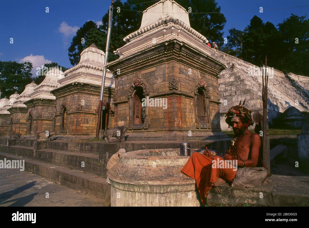 The most revered Hindu site in Nepal is the extensive Pashupatinath Temple complex, five kilometres east of central Kathmandu. The focus of devotion here is a large silver Shivalingam with four faces of Shiva carved on its sides, making it a 'Chaturmukhi-Linga', or four-faced Shivalingam. Pashupati is one of Shiva’s 1,008 names, his manifestation as 'Lord of all Beasts' (pashu means 'beasts', pati means 'lord'); he is considered the guardian deity of Nepal.   The main temple building around the Shivalingam was built under King Birpalendra Malla in 1696, however the temple is said to have alrea Stock Photo