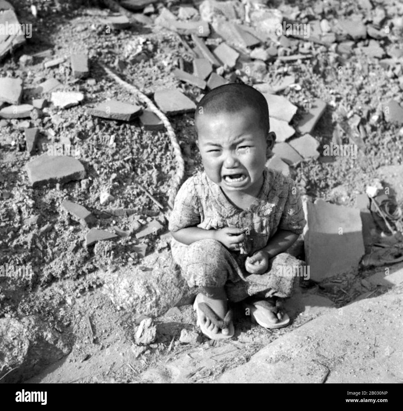 On Monday, August 6, 1945, at 8:15 am, the nuclear bomb 'Little Boy' was dropped on Hiroshima by an American B-29 bomber, the Enola Gay, directly killing an estimated 80,000 people.  By the end of the year, injury and radiation brought the total number of deaths to 90,000–166,000. The population before the bombing was around 340,000 to 350,000. Approximately 70% of the city's buildings were destroyed, and another 7% severely damaged. Stock Photo